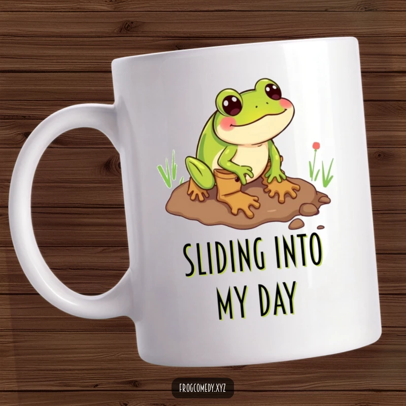 Funny mug depicting a green frog wearing rain boots, comically sliding face-first through a muddy puddle.