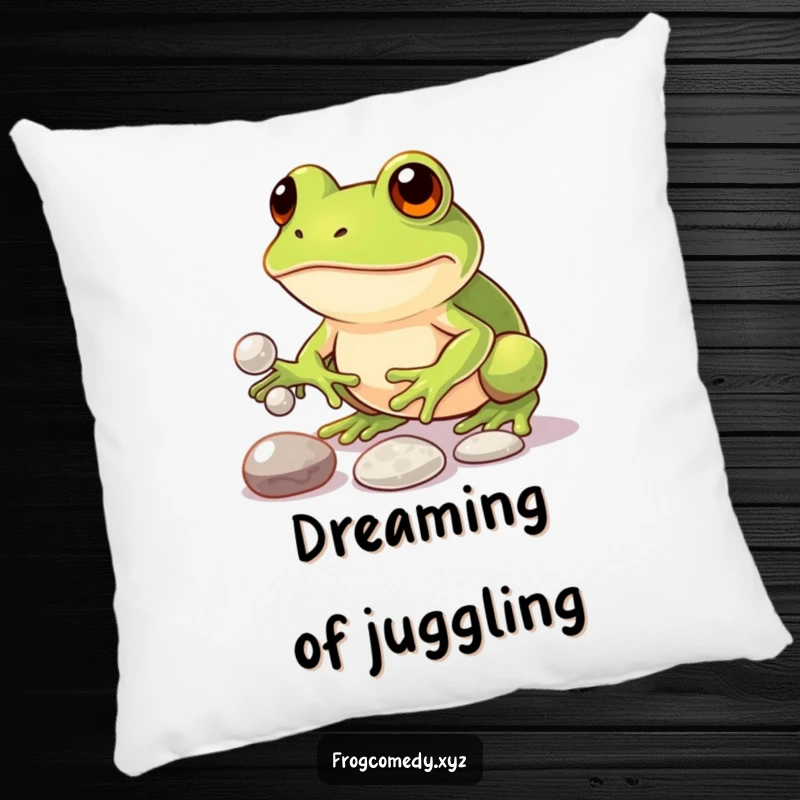 Funny pillow with a determined kawaii frog concentrating on juggling three small, shiny pebbles, offering comfort and humorous inspiration.