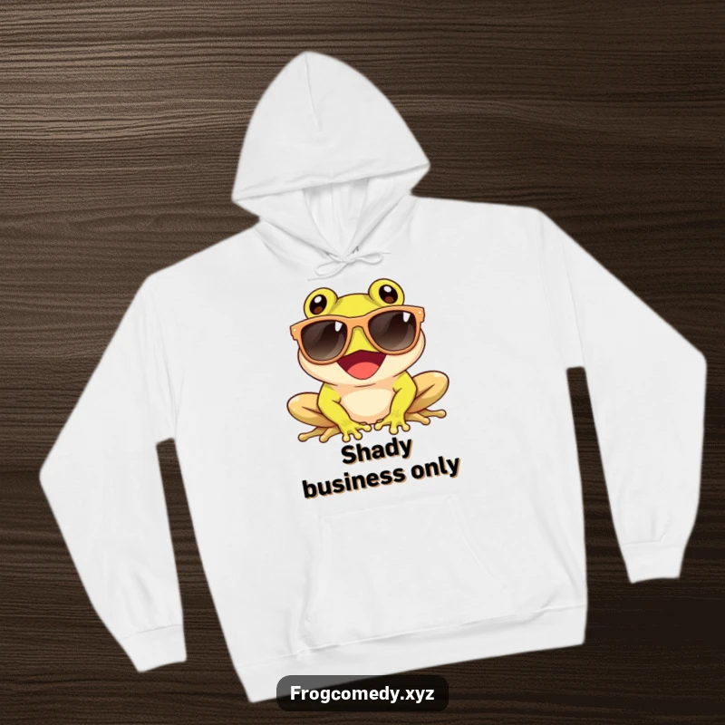 Funny hoodie depicting a giggling frog wearing oversized sunglasses while enjoying the sun, offering cozy and cool vibes.