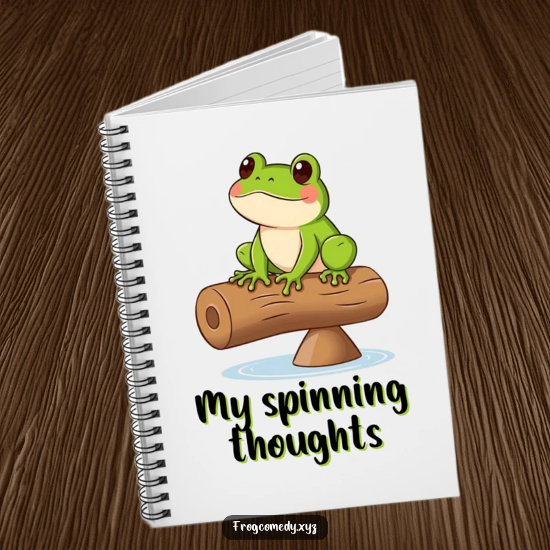 Funny notebook cover with a design of a green frog balancing on a spinning log, perfect for jotting ideas.
