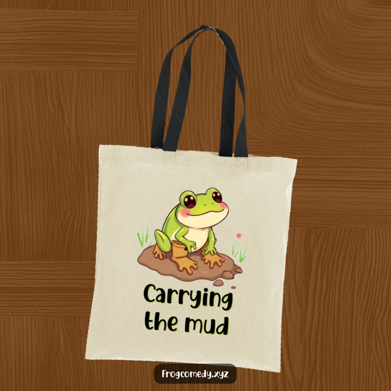 Funny tote bag featuring a frog wearing boots comically sliding through mud, perfect for carrying essentials with humor.